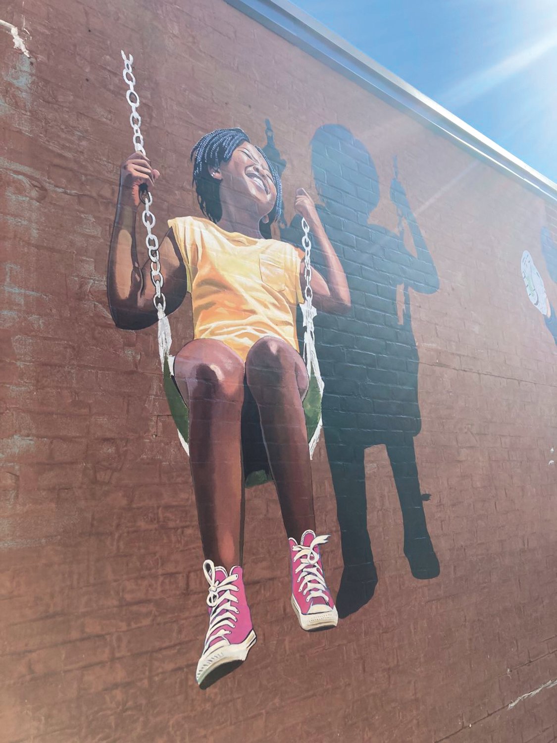 NEW MURALS: Three murals are currently being worked on in different alleyways at Garden City. All three murals are located in the section of the center that holds Francesca’s and the Gap; local artists are creating the works. (Cranston Herald photo)